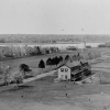 <p>Buildings and trees lined the Parade Ground (left center), located in the middle of Davids Island. View north-northwest, ca. 1889.</p>